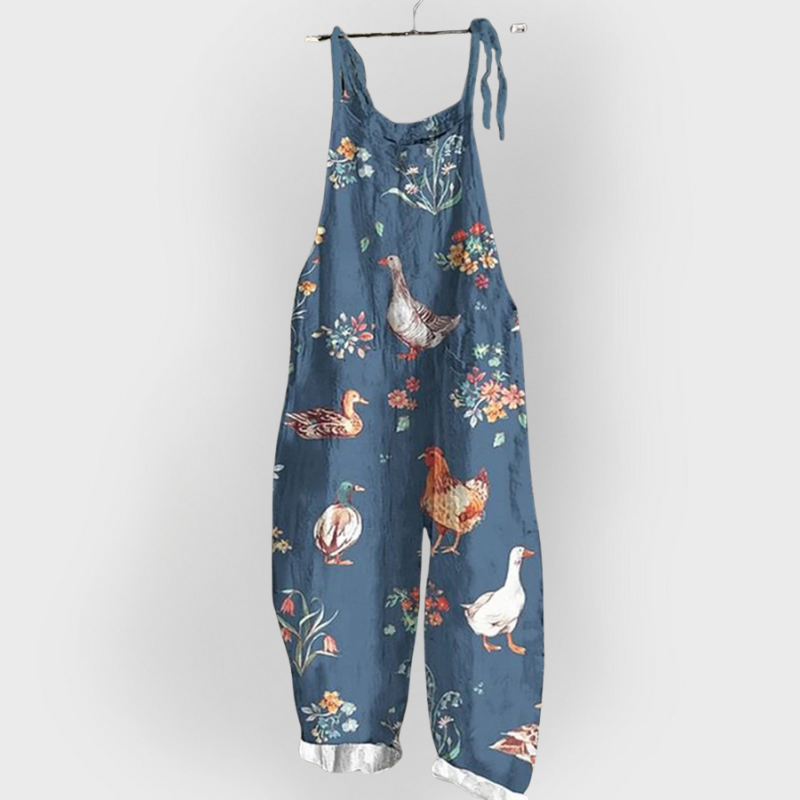 Amalia |  Salopette Artigianale blu con fiori e animali