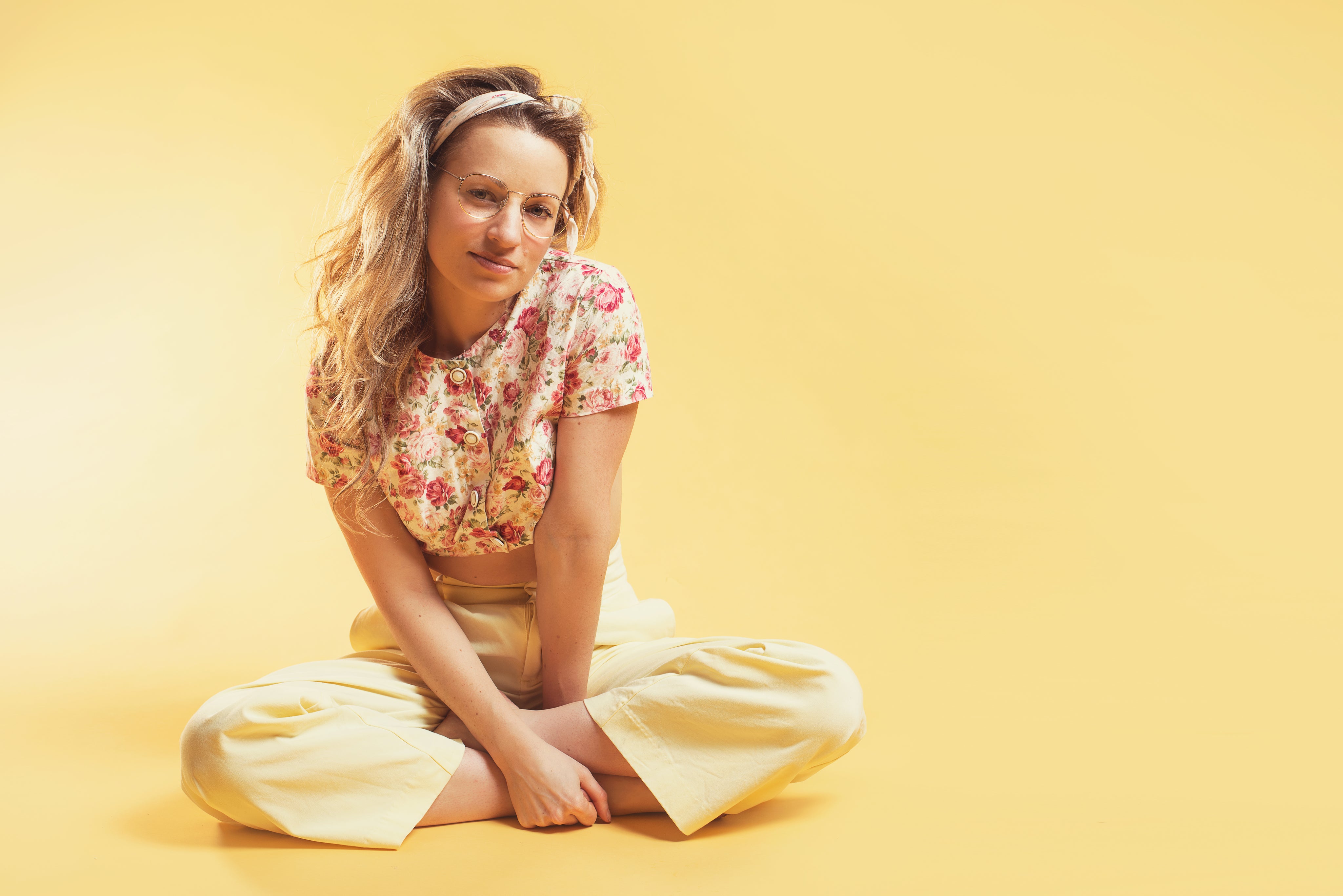 person-sits-cross-legged-in-summer-fashion.jpg